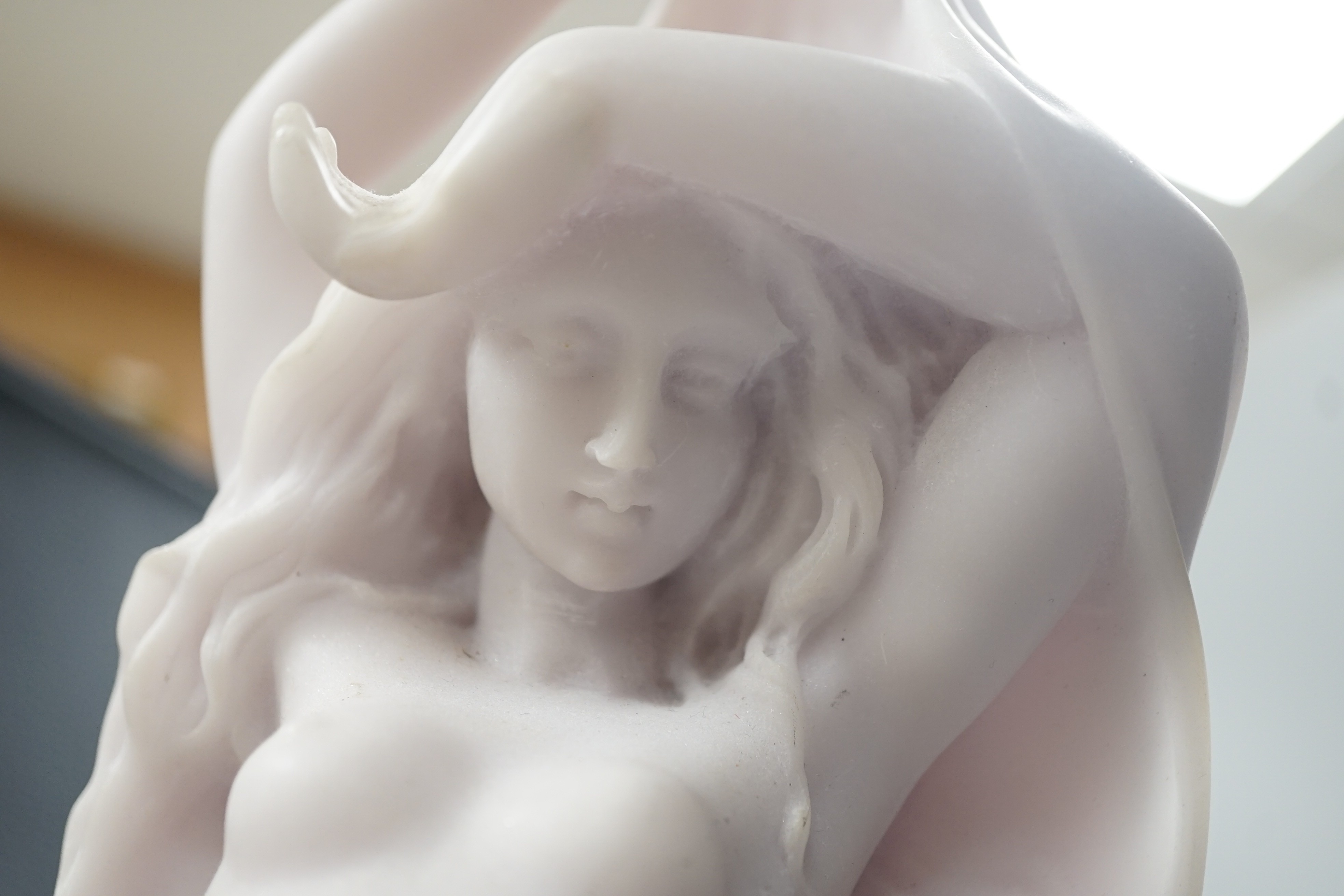 A resin marble figure of Venus and Cupid, 49cm high